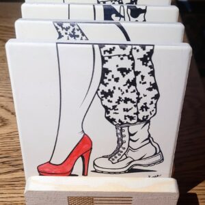 A close up of a couple 's legs on top of a wooden table.