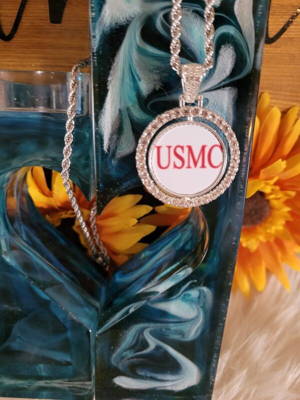 A necklace that says usmc on it.