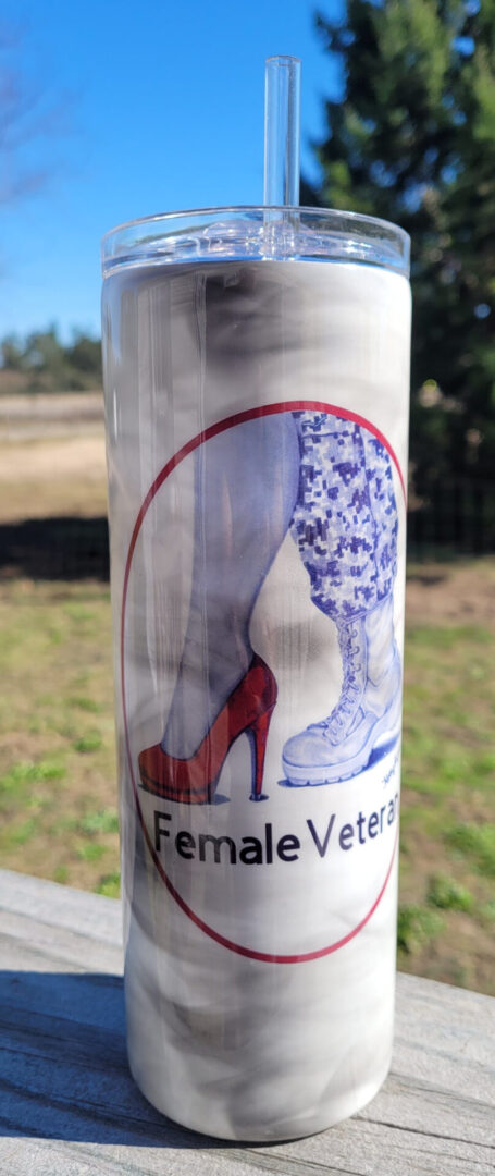 Tumbler depicting a graphic with two legs: one in a red High Heel and the other in a Combat Boot, encircled by the text "female veteran".
Product Name: High Heel and Combat Boot Tumbler (20 Oz. Skinny)