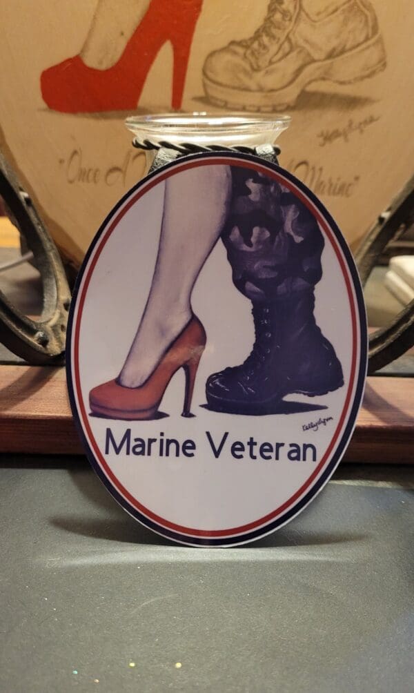 A marine veteran sticker with a woman 's legs and boots.