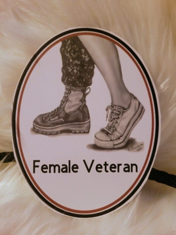 A female veteran sign with two pairs of shoes on it.