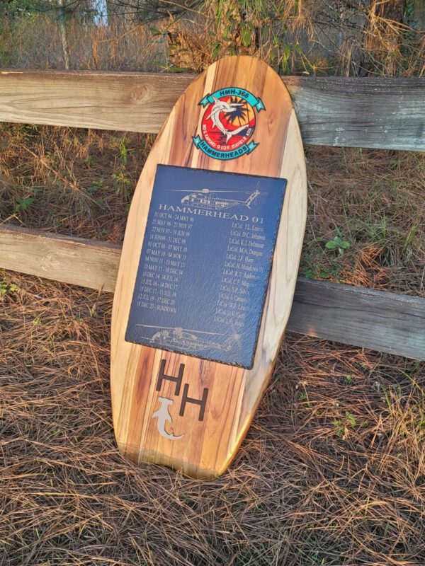 A wooden board with a plaque on it