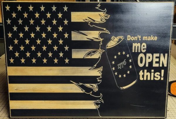 A Custom Flag art piece with a tattered design, featuring an eagle and a clenched fist holding a can, and the text "don't make me open this!.