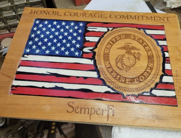 A wooden plaque with an american flag and seal.