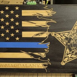 Custom Flags with a carved american flag design featuring a thin blue line and an emblem of santa rosa sheriff’s office, dedicated to sgt. andrew mcdalany.