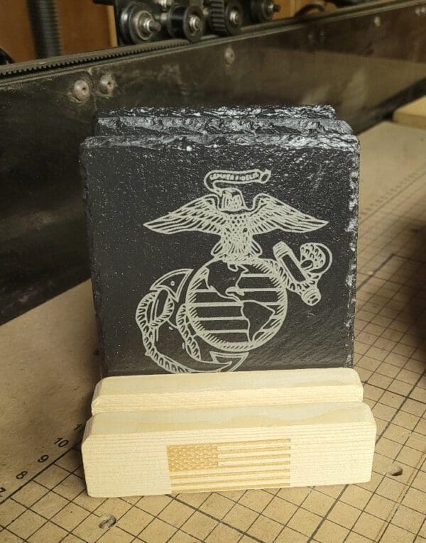 A picture of some marine corps coasters on top of a table.