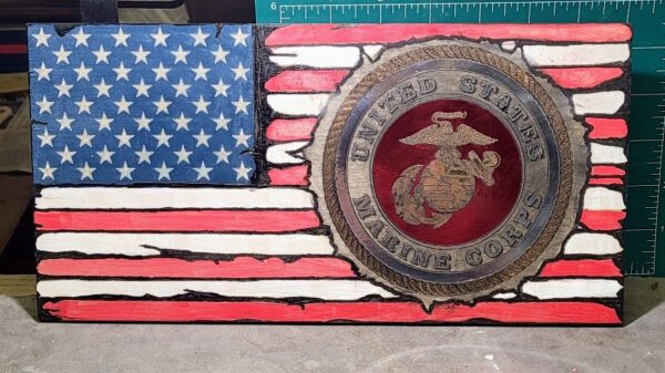 A Custom Flag with a carved and painted United States Marine Corps emblem on the right.