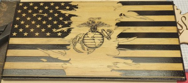 A wooden box with an image of the marine corps on it.