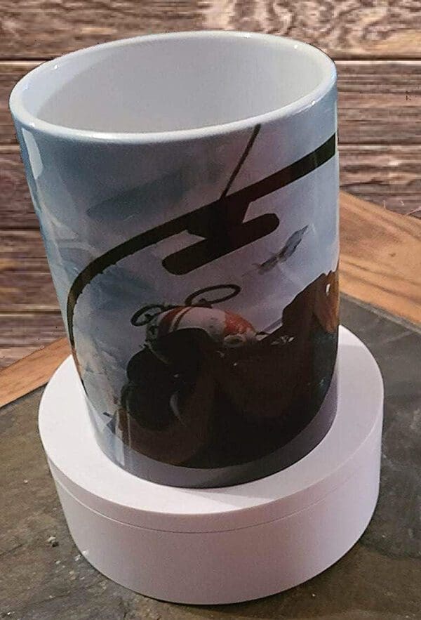 A coffee mug sitting on top of a wooden table.