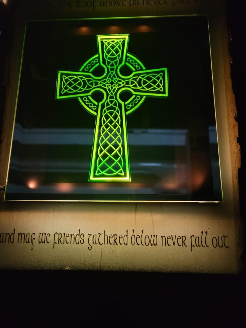 A green cross with the words " and may are friends gathered before never pull out."
