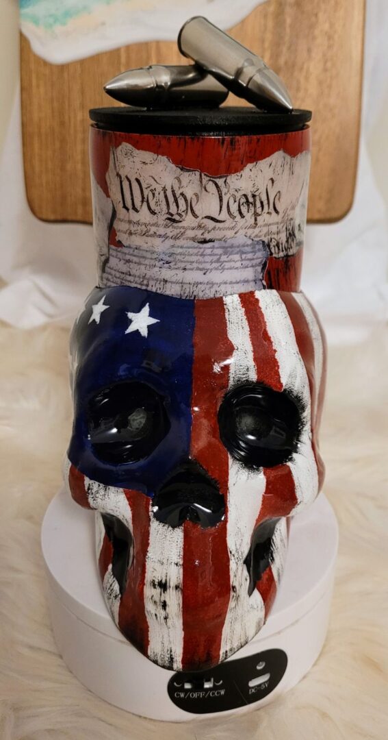A skull with the american flag painted on it.