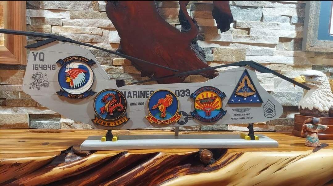 A display of military patches on a wall.